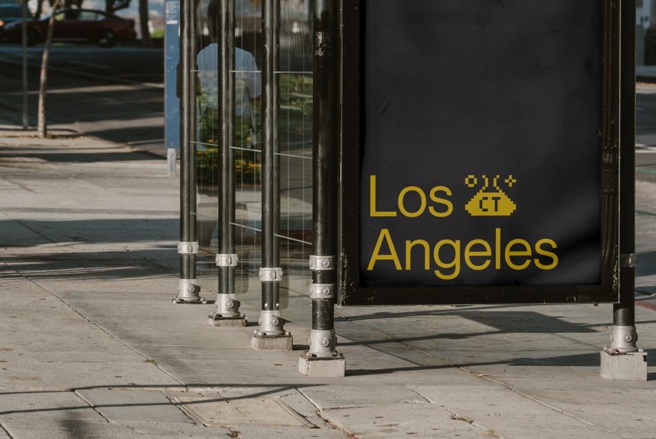 Urban street scene featuring a bus stop with a creative Los Angeles sign, perfect for graphics and modern city mockups.